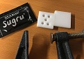 Stuff is called sugru its a type of moldable glue that sets into a rubber.
